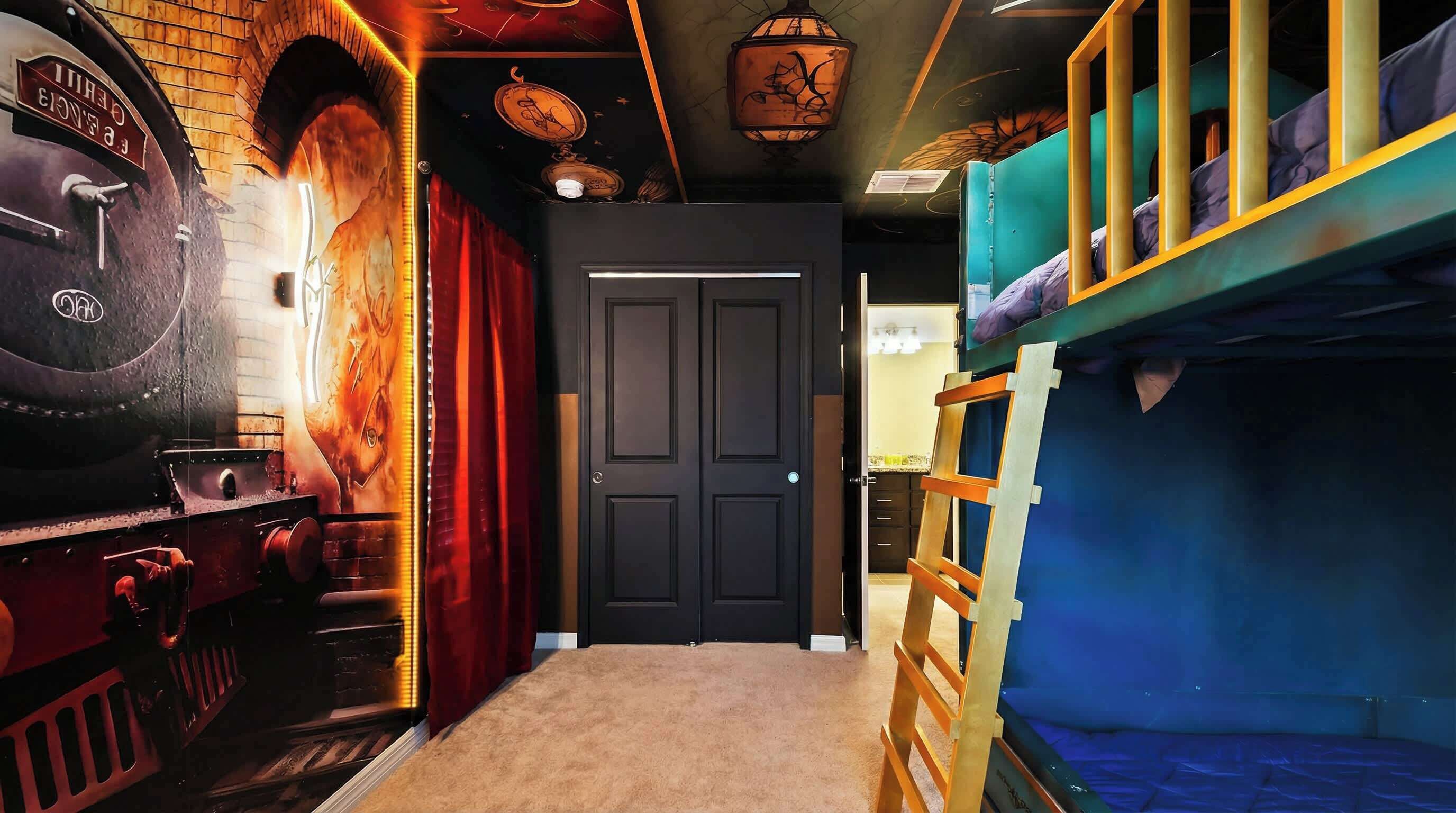 A room with a train-themed decor, including a model train set and a mural. There are bunk beds with blue bedding and a ladder.