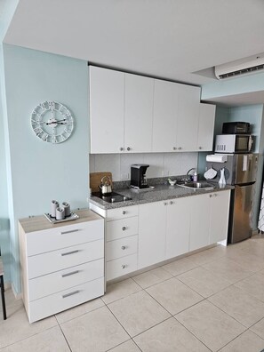 Fridge, microwave, stovetop, coffee/tea maker