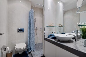 Shower, hair dryer, towels, soap
