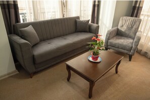 Family Apartment | Living area | Flat-screen TV