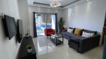 City Apartment, 3 Bedrooms, Balcony | Living room | 47-inch LED TV with digital channels, Netflix, streaming services