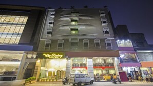 A multi-story building with a ground-floor luxury hotel named "Elite Residency." - SYN Elite Residency (Hyderabad)