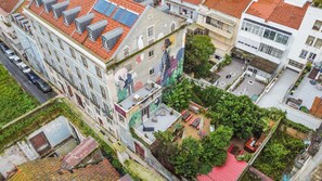 Experience the unique blend of traditional and modern architecture, with a rooftop garden offering serene seating areas amidst vibrant urban surroundings.