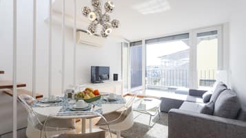 Panoramic Duplex, 2 Bedrooms, Terrace, River View | Living area | 20-inch LCD TV with cable channels