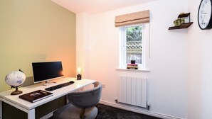 A study room with a desk, computer, chair, globe, and books. - Amazing City Centre Home  (Derby)