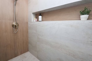 Shower, hair dryer, towels, soap