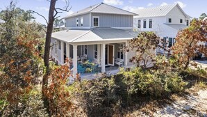 A two-story house with a covered porch and a swimming pool. - Sugar Blue, walk to the beach
 (Santa Rosa Beach)