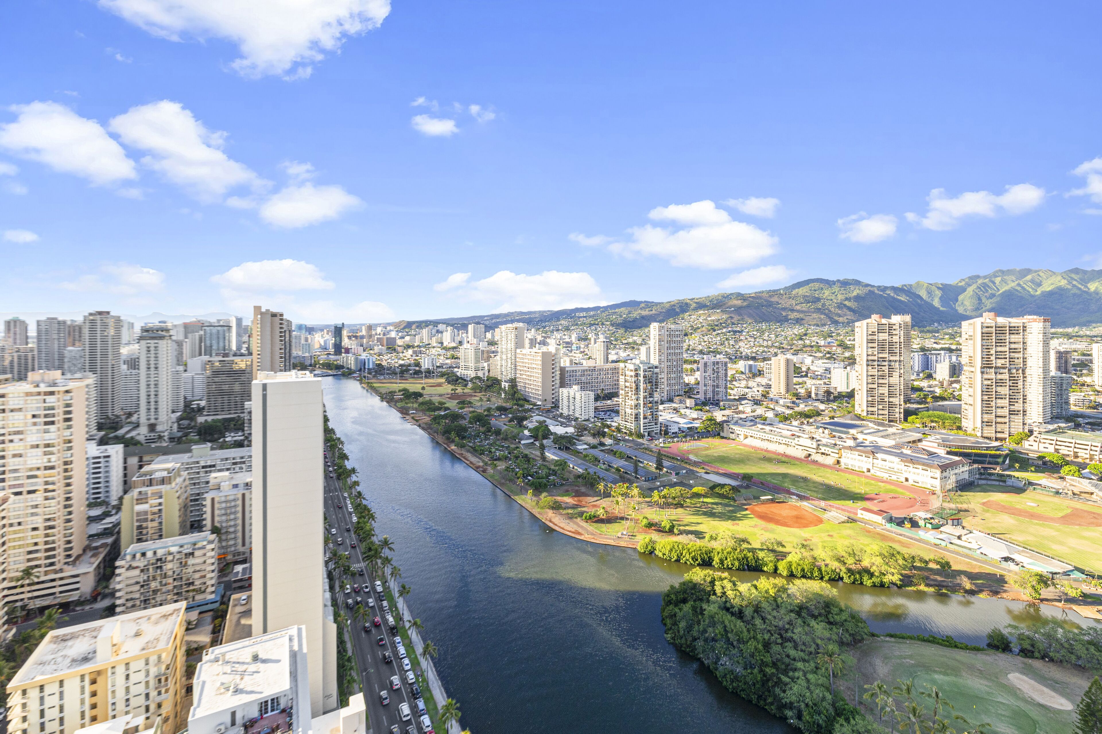 A river running through a city with high-rise buildings on both sides.