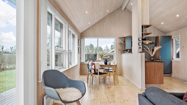 A spacious room with large windows, a dining area, and a kitchen. - Cozy home in Odder with WiFi (Odder)