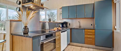 Fridge, stovetop, dishwasher, coffee/tea maker