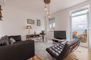 Family Duplex, 3 Bedrooms, Balcony, River View | Living area | 20-inch LCD TV with cable channels - Cortes Apartment in Lisbon Historic (Lisbon)
