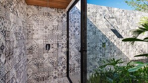 A room with patterned walls and a large window. - Beachside Bliss 4BR Lux Villa, Pool, Terrace, Golf (Pinilla)
