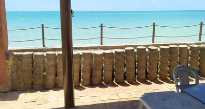 A private chale less than 20 feet from the ocean