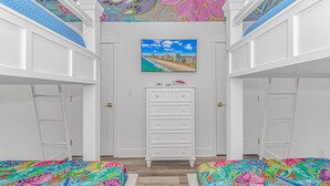 A bedroom with a colorful ceiling mural, a cityscape painting, and a white dresser. - New Beautiful Home @ Ocean Lakes Family  Campground! BE THE FIRST TO RENT! (Myrtle Beach)