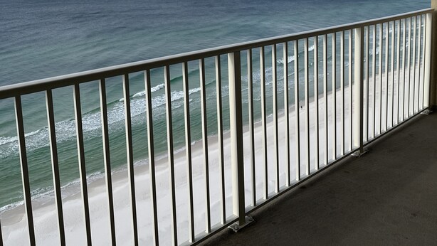 A balcony with a view of the ocean and beach. - Beautiful ocean view and beach front close to shopping downtown  (Panama City Beach)
