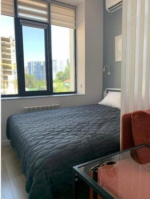 1 غرفة نوم ومكواة/لوح كي وواي فاي وملاءات أسرّة