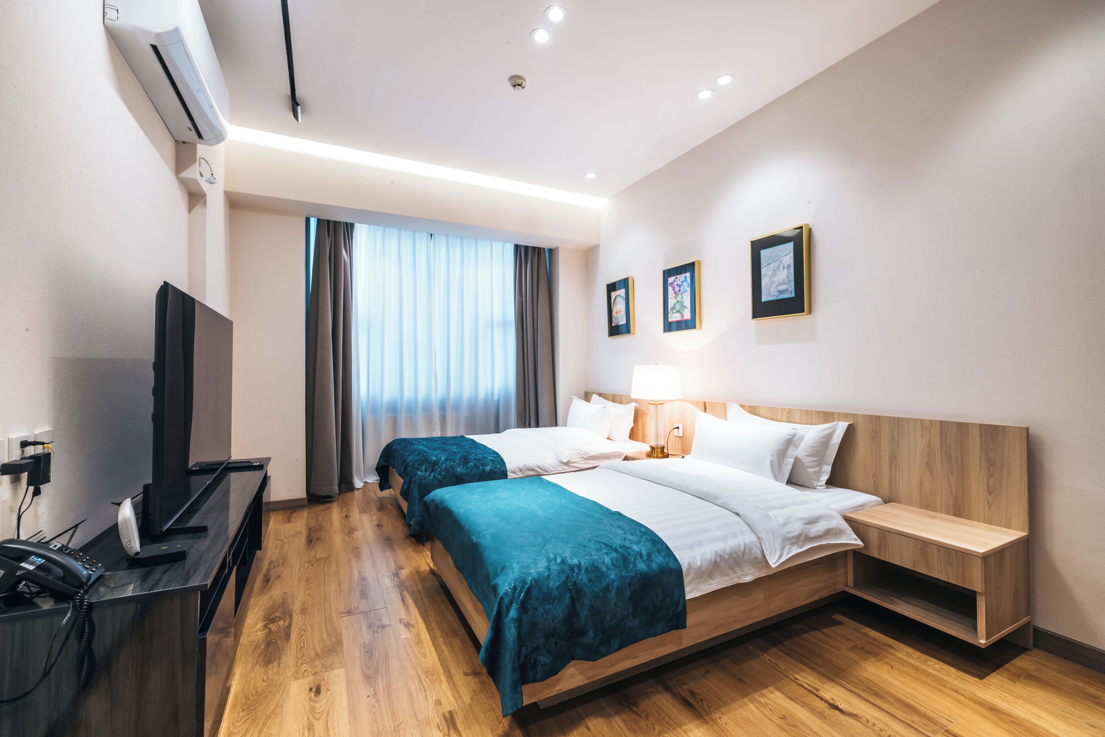 Twin Room, City View | Desk, laptop workspace, blackout drapes, iron/ironing board