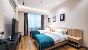 Twin Room, City View | Desk, laptop workspace, blackout drapes, iron/ironing board