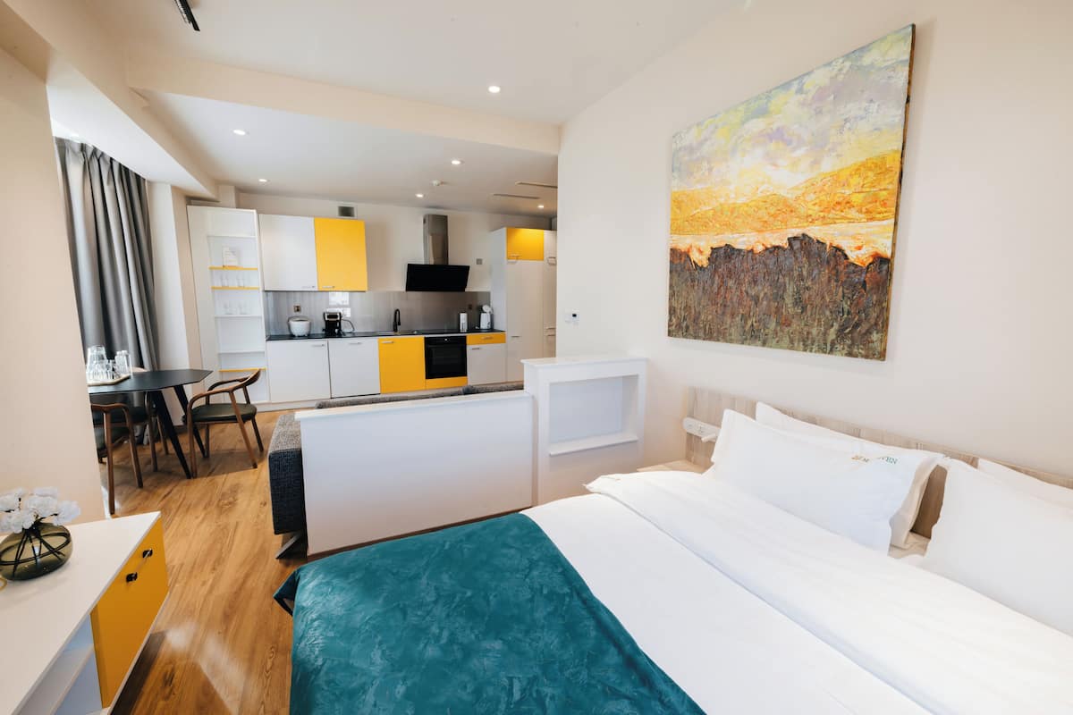 Family Suite | Living area | 52-inch flat-screen TV with cable channels