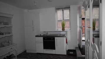 Fridge, toaster, dining tables