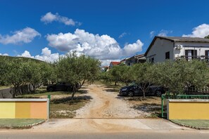 Escape to a serene rural retreat surrounded by lush trees and a tranquil atmosphere.