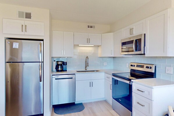 Fridge, microwave, oven, stovetop - Modern Oceanfront Condo | Steps to Beach & Boardwalk | Pool, Elevator, Private Beach Access (Carolina Beach)