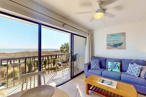 TV, books - Modern Oceanfront Condo | Steps to Beach & Boardwalk | Pool, Elevator, Private Beach Access (Carolina Beach)