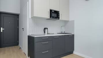 Microwave, electric kettle, cookware/dishes/utensils