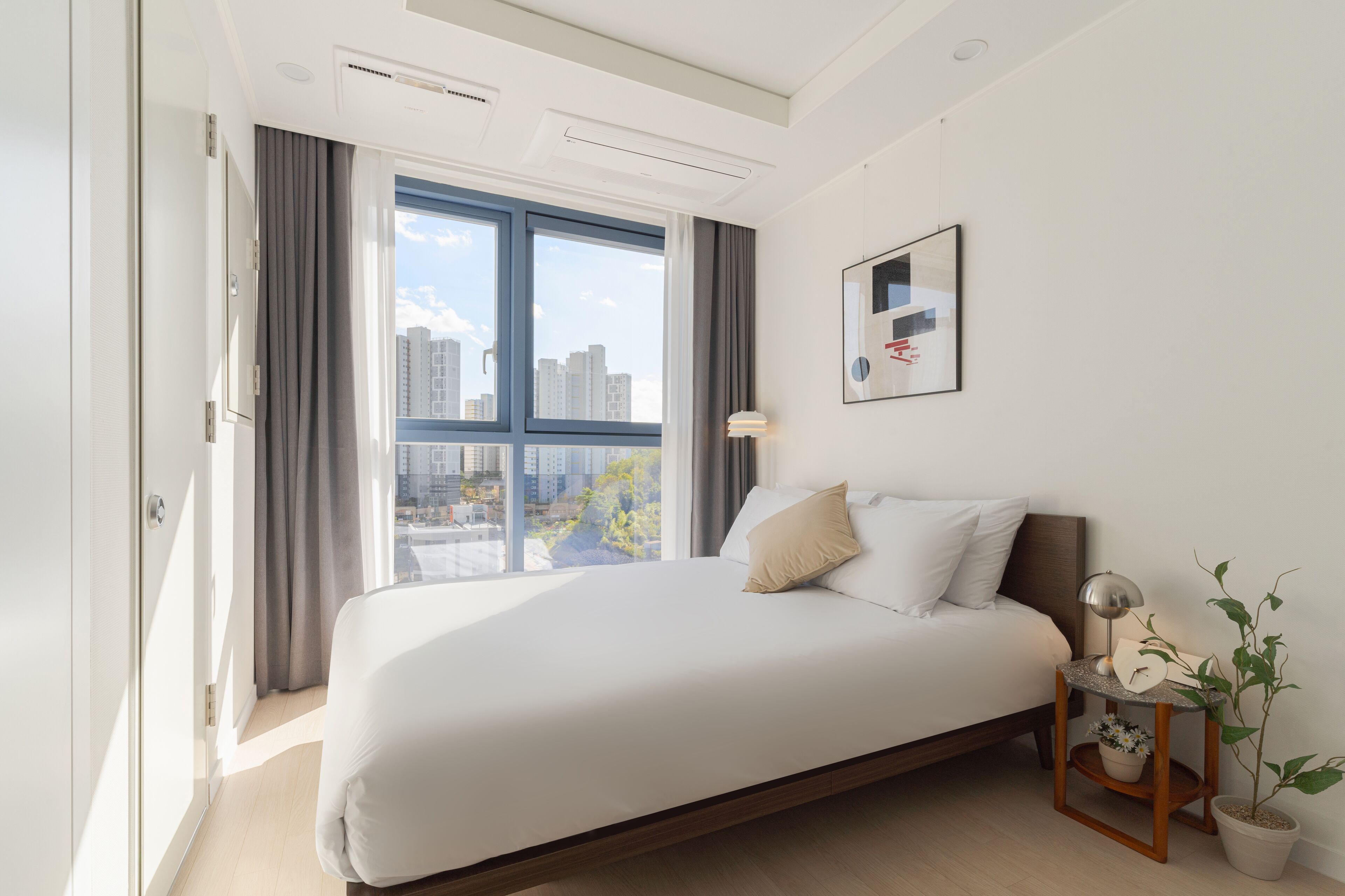 Studio | Hypo-allergenic bedding, desk, laptop workspace, blackout drapes