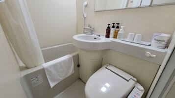 Combined shower/tub, hair dryer, slippers, towels