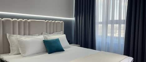 1 غرفة نوم ومكواة/لوح كي وملاءات أسرّة