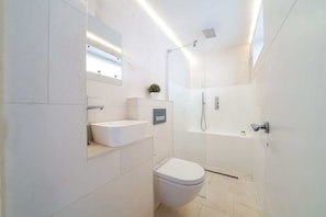 Shower, hair dryer, towels, soap