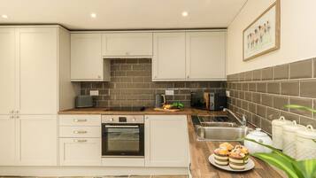 Fridge, dishwasher, electric kettle, cookware/dishes/utensils