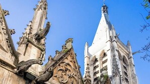 A historic building with Gothic architecture, featuring pointed arches and intricate stone carvings. - A Delightful 2-BR/2BA at Saint Michel - Notre Dame (Paris)