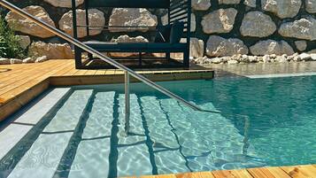 Indoor pool, seasonal outdoor pool, pool umbrellas, pool loungers