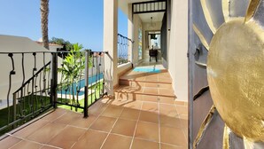 A covered outdoor area with a tiled floor, a metal railing, and a view of a swimming pool. - Villa with Privacy and Spectacular Views of Teide, Sea, Orotava Valley (La Orotava)