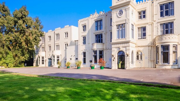 A large, historic building with a prominent tower and multiple windows. - Botleigh Grange Hotel & Spa (Southampton)