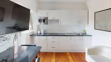 Fridge, microwave, cookware/dishes/utensils