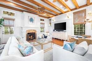 Smart TV, fireplace, books, offices