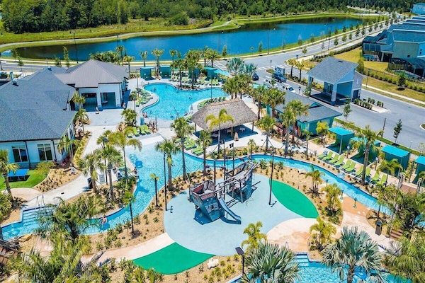 The Hideaway Club, which features a resort-style pool, two waterslides, a lazy river, and a kids' splash park