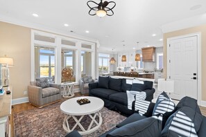 Living area - Oasis Vacations, Old Man By The Sea. Infinity Pool, Elevator, Marsh Views! (Ocean Isle Beach)