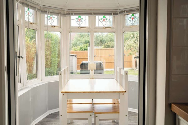 The Dining Space: gather round the dining table in the eating space by the bright bay window.
