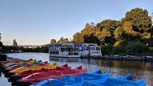 A row of colorful pedal boats docked at a calm river. - Budget friendly Edwardian home - Sleeps up to 7 (Cheshire West and Chester)