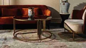 A living room with a red sofa, a round coffee table, and a chair. - City Hotel by Waves (Kenitra)