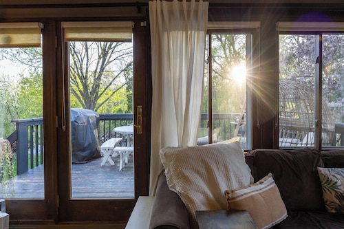 Charming Cottage with Hot Tub, Fire Pit, & Wooded Backyard