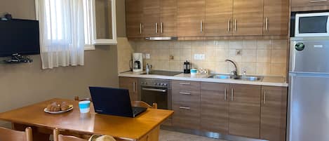 Standard Apartment | Private kitchen | Coffee/tea maker, electric kettle, dining tables