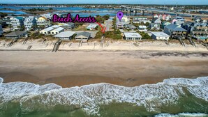 A coastal town with beachfront properties, a bridge, and a beach access point. - Ocean-View Retreat, Sleep 8, 6-Minute Walk to Restaurants, Pet friendly (Surf City)