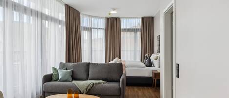 Economy suite with sofa bed & balcony | Individually decorated, individually furnished, desk, laptop workspace