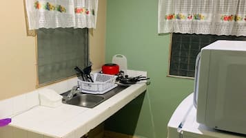 Fridge, microwave, stovetop, coffee/tea maker