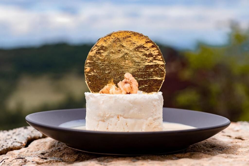 A dessert on a plate with a scenic background.